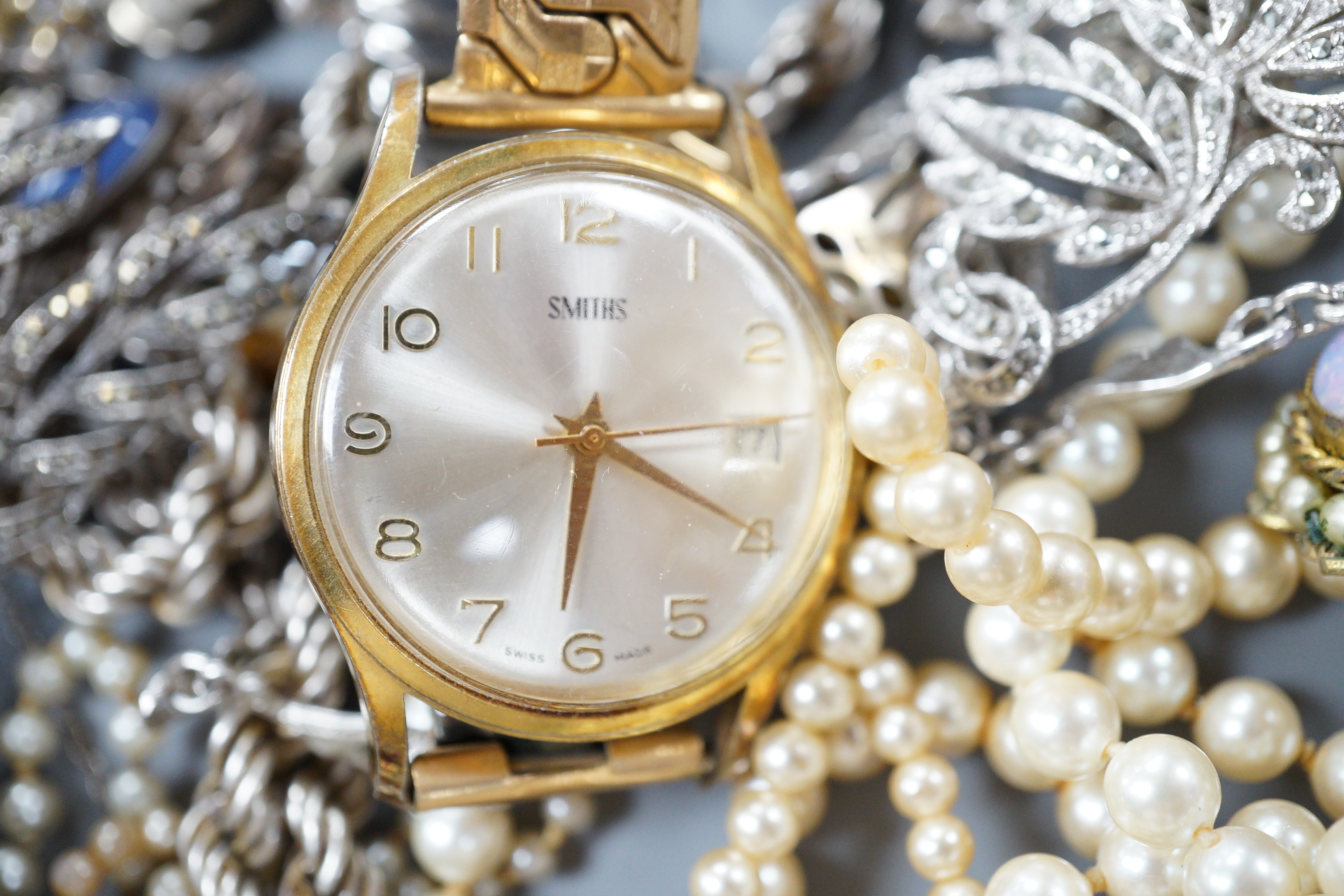 A quantity of assorted costume jewellery, including marcasite and three gentleman's wrist watches including a 9ct Record.